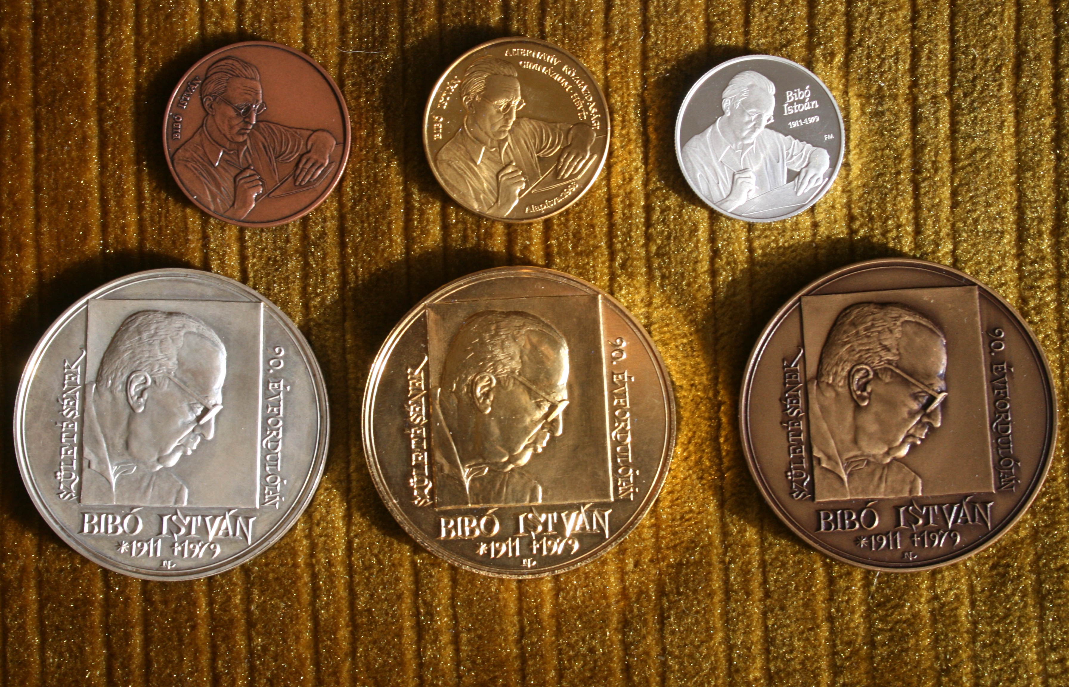 István Bibó's memorial coins and plaquettes.Masters: for the three coins above: unknown, 1990s (Prizes of István Bibó Secondary School, Hévíz, Hungary)three medals bellow: Nagy, Lajos 2001.+ a handwriten list of art pieces lended, with their creators' names for a 2011 Bibó memorial exhibition held at Lorand Eötvös University, Budapest