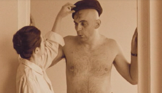 Scene in which the main actor whistles the song 'Lili Marleen' while his girl-friend draws a red star on his forehead and in the background a sovjet speech about Western imperialism can be heard.
