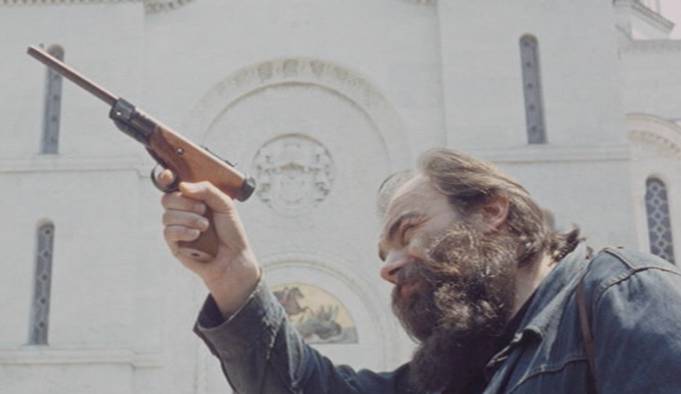 Scene in which the main actor expresses an anti-clerical attitude by pointing a gun in a church where members of the serbian royal family are buried.