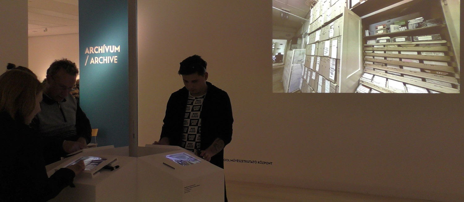 Exhibition interior showing the Archives section at Rock/Tér/Idő [Rock/Space/Time] exhibition (Museum Ludwig, Budapest, 2016), where the audience had access to a 3D virtual tour in the Artpool archives