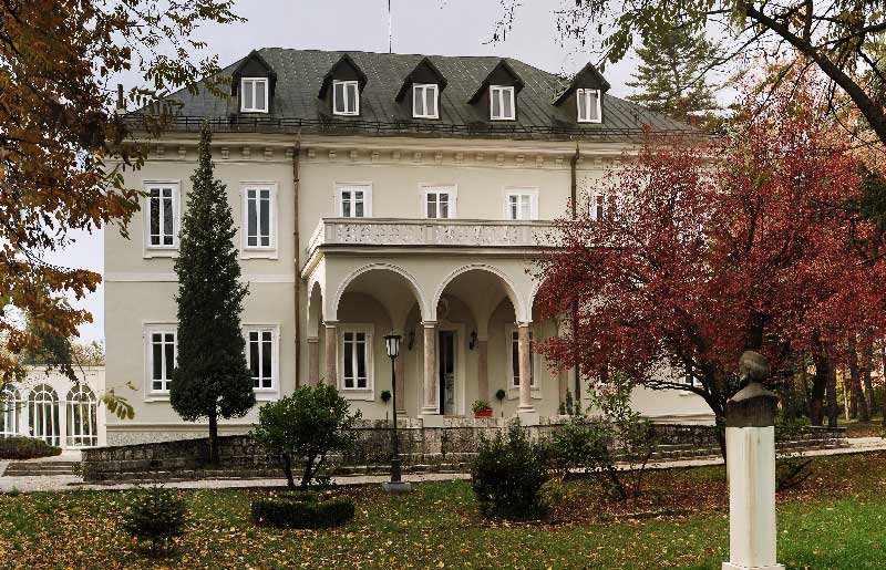 The illustration shows one of the two buildings of National Library of Montenegro located in Cetinje.