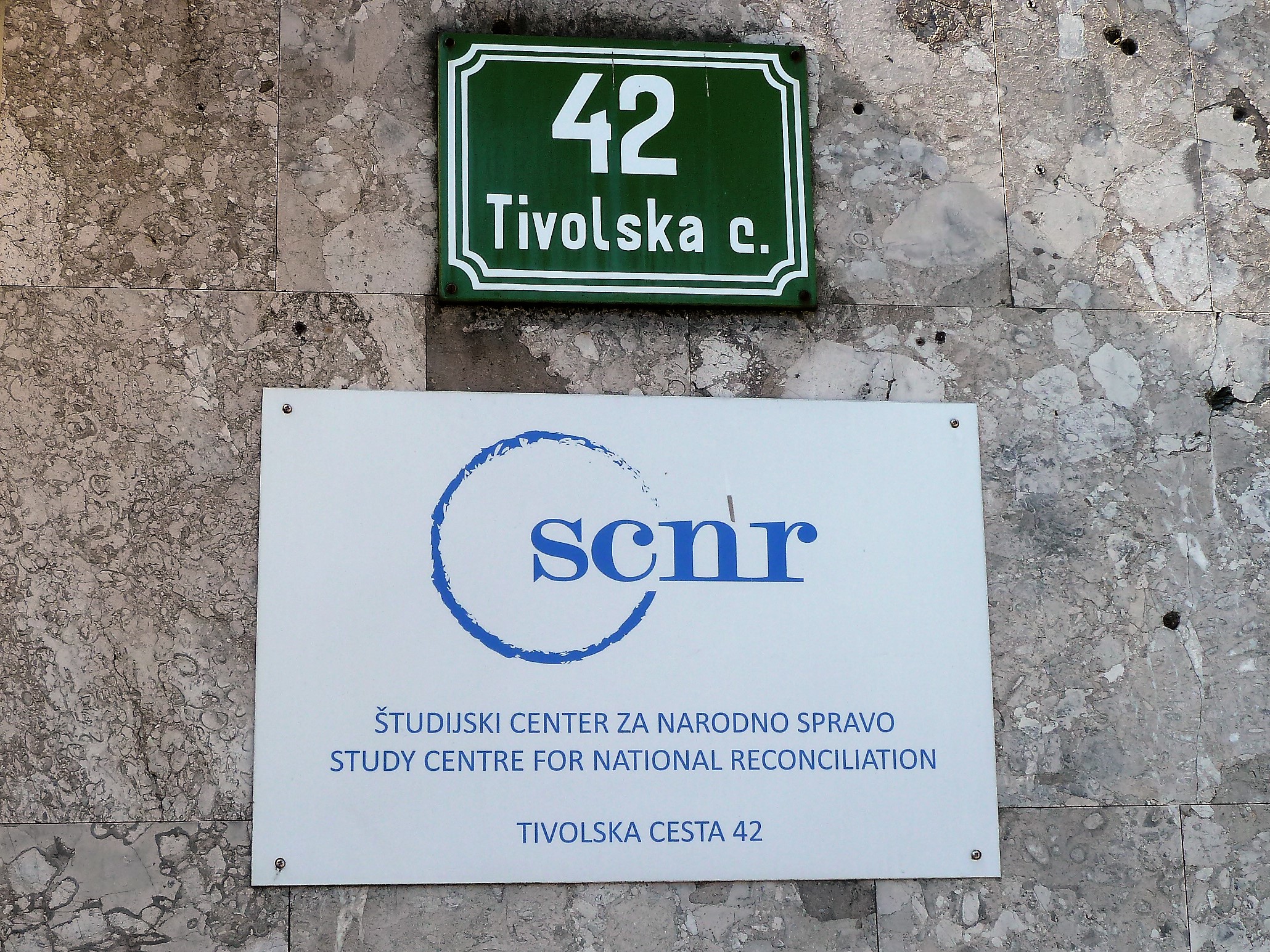 The plate with the name of the Study Centre for National Reconciliation (SCNR) at Tivolska 42,1000 Ljubljana.