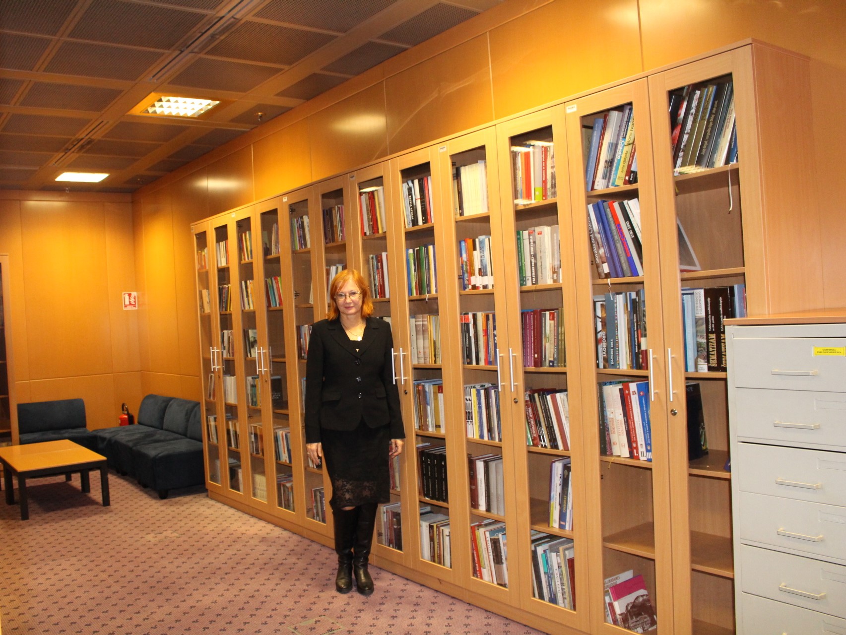 Željka Lovrenčić and the books held in the Foreign Croatica Collection.