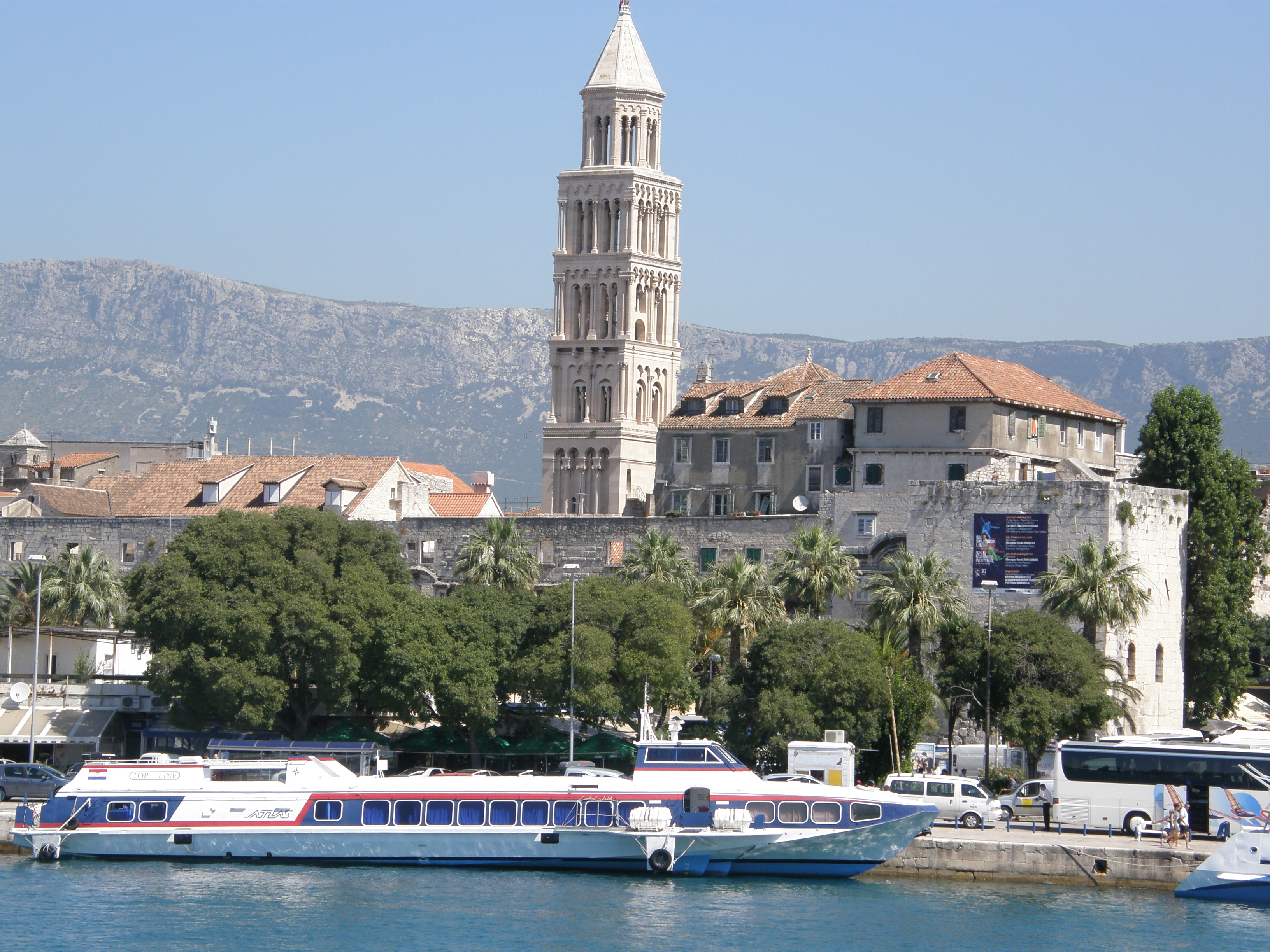 Hydrofoil ship in the port of Split and the bell tower of the Cathedral St. Duje in background, also Diocletian's palace, 2009.
