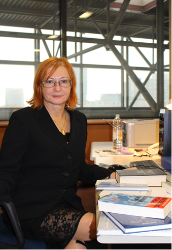Željka Lovrenčić at her office desk.