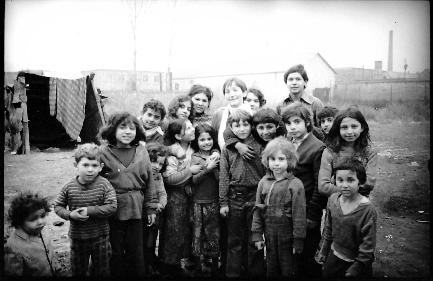 Children in a Gipsy colony in Esztergom-kertváros, Hungary, 1977Up in the middle can be seen sociologist Ottília Solt, who two years later founded SZETA together with seven friends.