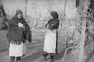 This is one of the thousand photos what Fél, Edit and Hofer, Tamás took during their fieldwork in Átány. The title of the photo: Two women in traditional costume in Átány.  Two women in traditional customs in Átány, 1951.