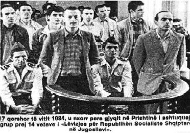 The photograph shows a group of fourteen people of The Movement for the Albanian Socialist Republic in Yugoslavia brought to trial in Pristina on 17 June 1984. The picture was published in an article by Sabile Keçmezi-Basha on the historical website Pashtriku (http://www.pashtriku.org/?kat=64&shkrimi=1263).